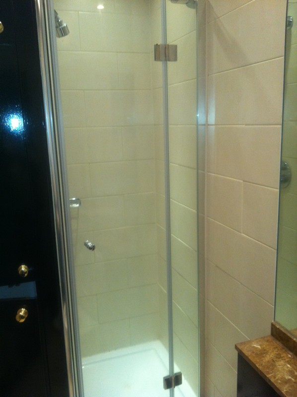 Frameless glass shower enclosure with chrome fittings in Elephant & Castle