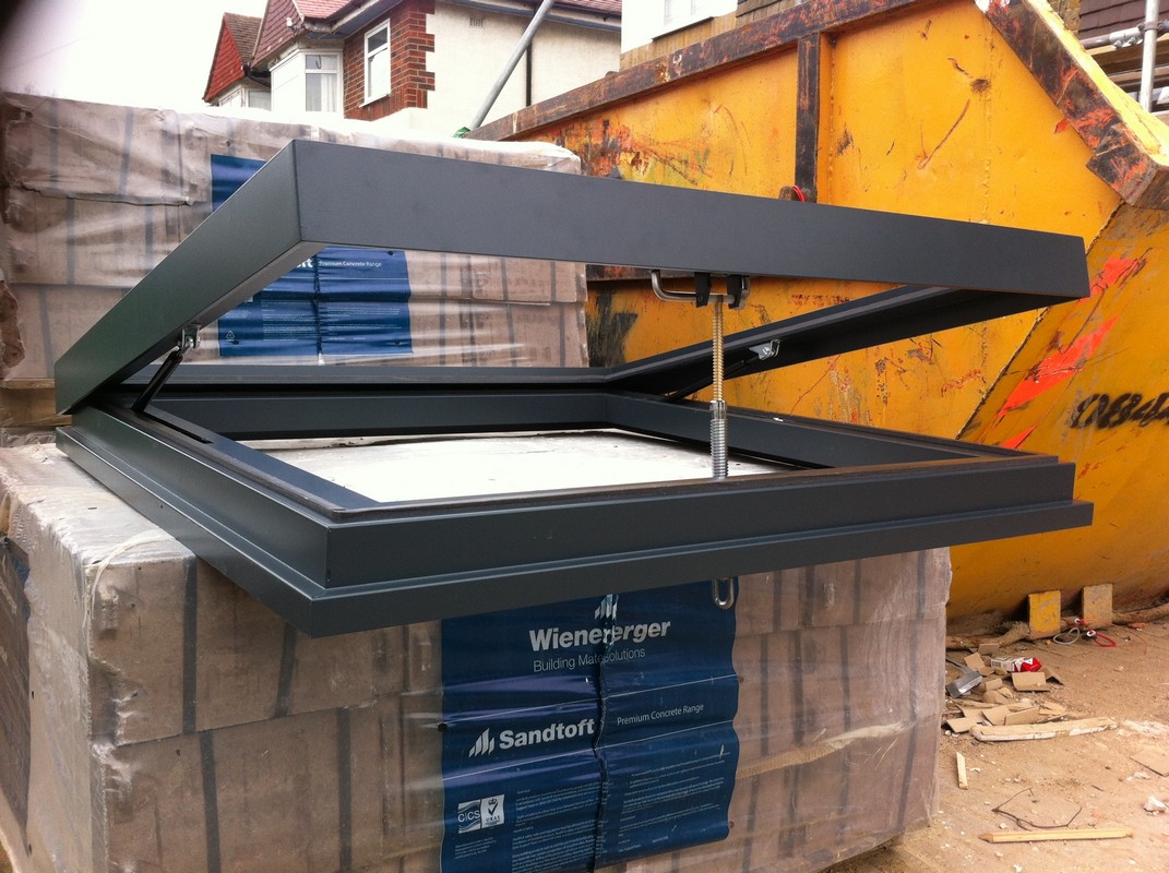Opening flat roof skylight in anthracite grey installed in Elephant & Castle